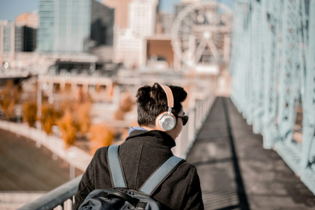 Walking with Headphones and Listening to Music.